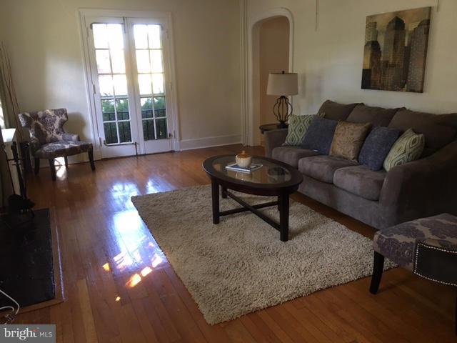4419 Underwood Road Baltimore, MD 21218 - Photo 3 of 30 a living room with furniture and wooden floor