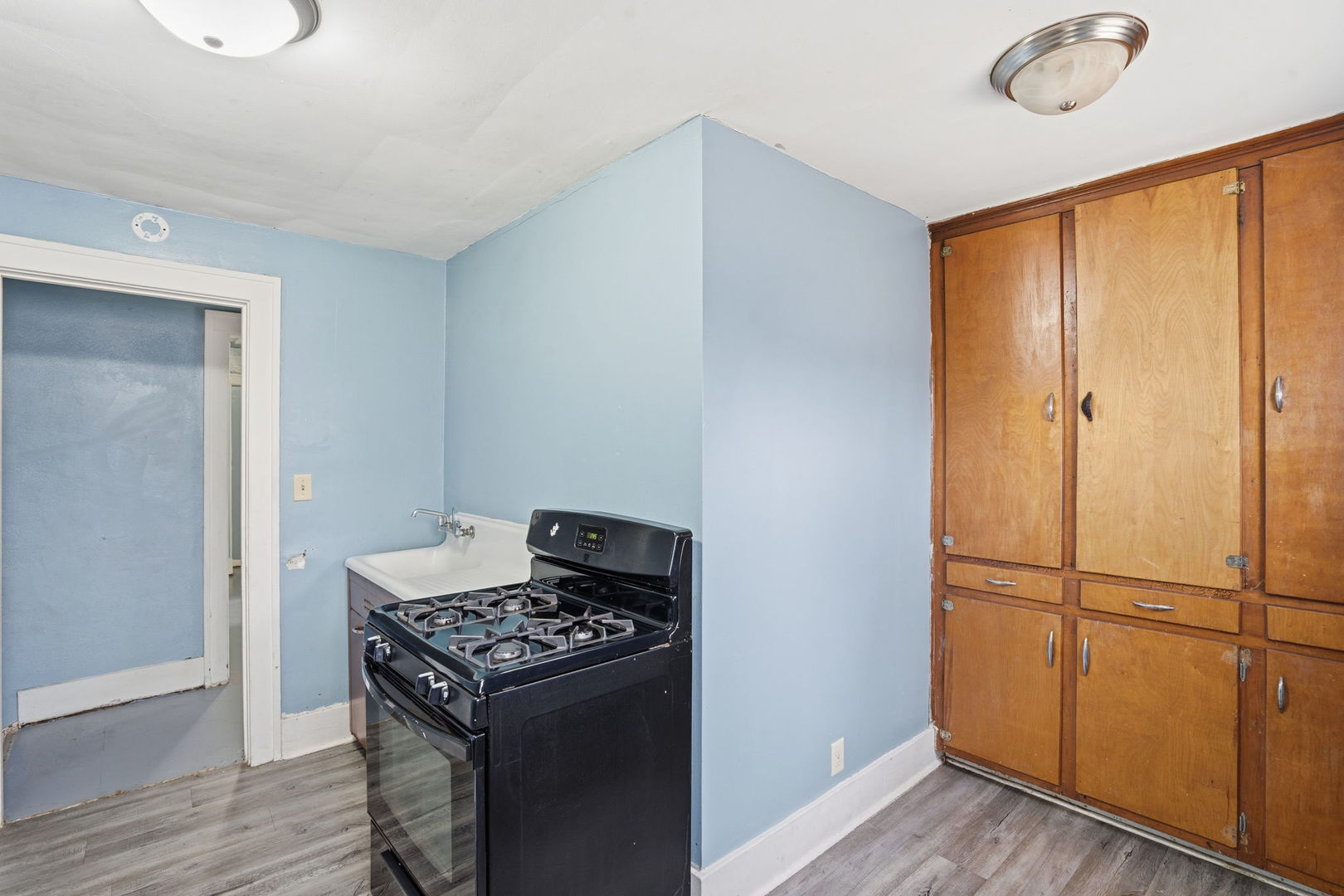 903 44th Street Rock Island, IL 61201 - Photo 20 of 28 a kitchen with a stove and a refrigerator