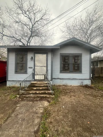 a house with trees in the background