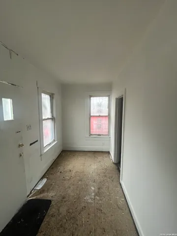 a view of a big room with windows and cabinet