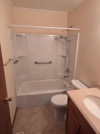 a bathroom with a sink a toilet and a bathtub