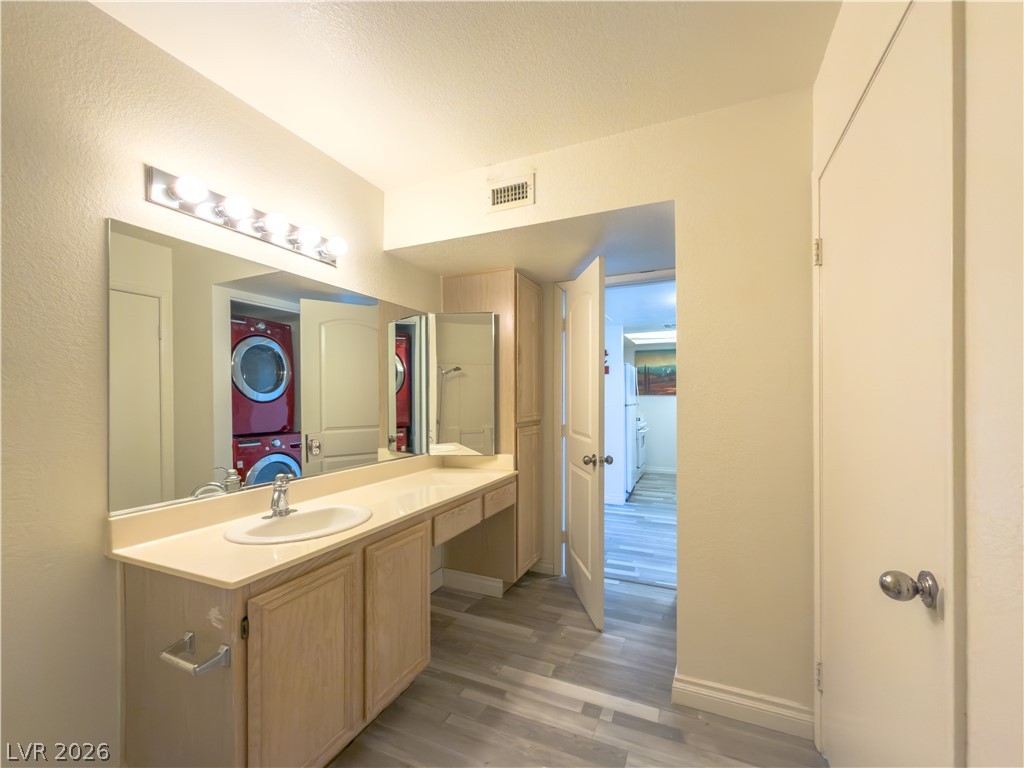 8070 West Russell Road, Unit 2063 Las Vegas, NV 89113 - Photo 6 of 9 A well-lit vanity provides ample space for daily routines.