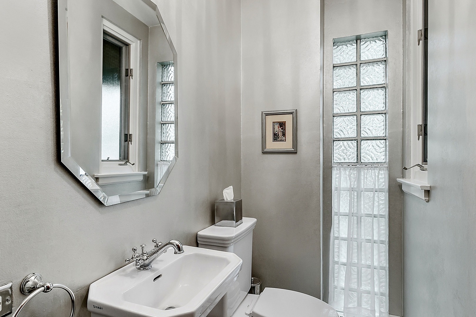 424 Uvedale Road Riverside, IL 60546 - Photo 17 of 46 a bathroom with a toilet a sink and mirror