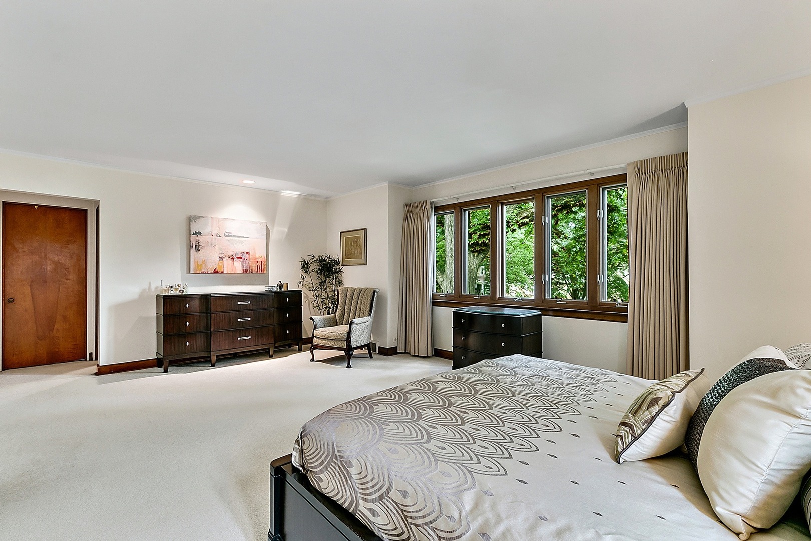 424 Uvedale Road Riverside, IL 60546 - Photo 19 of 46 a bed sitting in a spacious bedroom next to a window