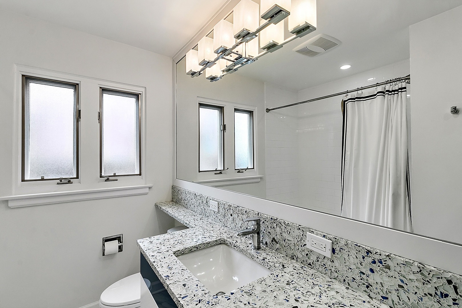 424 Uvedale Road Riverside, IL 60546 - Photo 24 of 46 a bathroom with a sink a toilet and a mirror