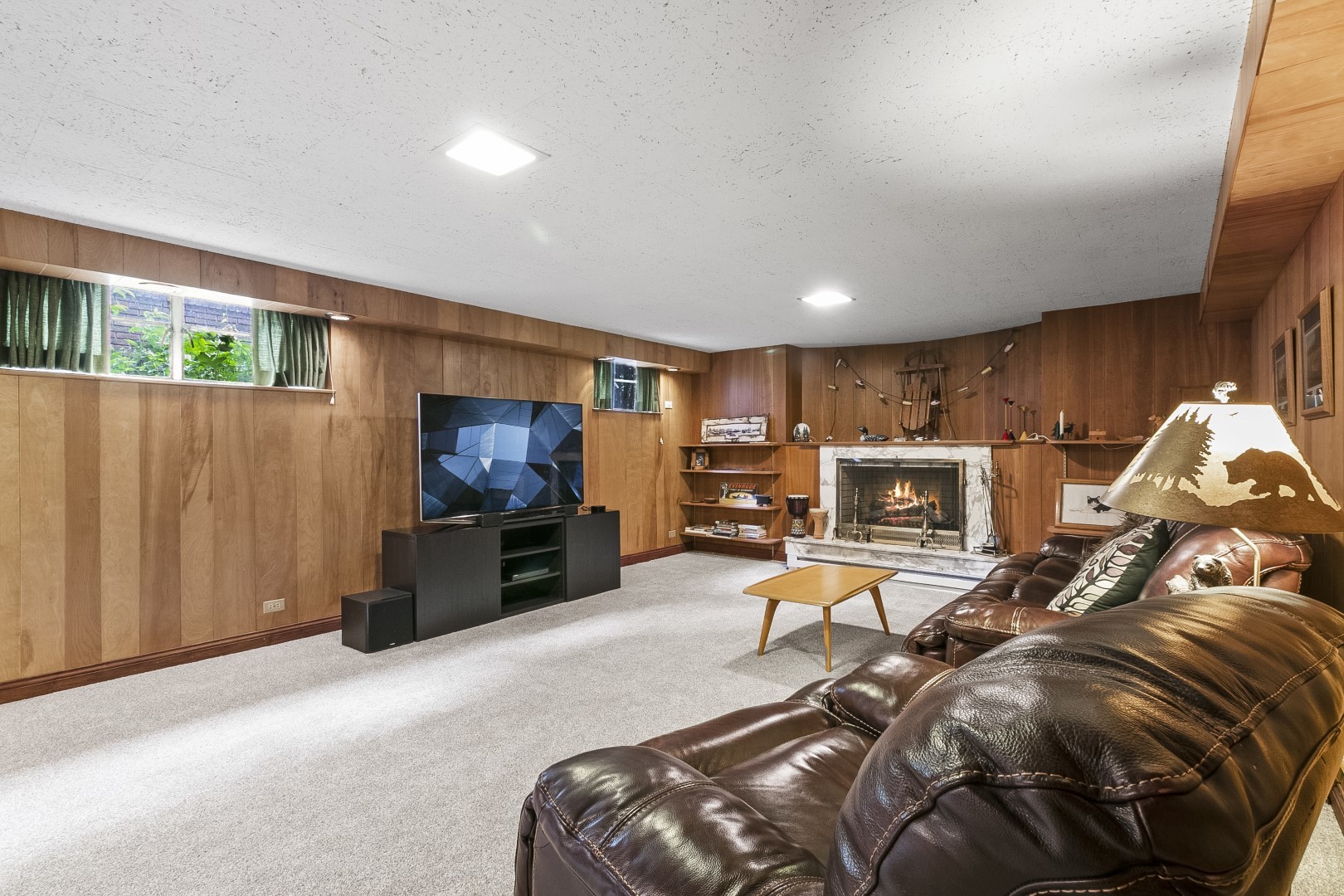 424 Uvedale Road Riverside, IL 60546 - Photo 29 of 46 a living room with furniture a flat screen tv and a window