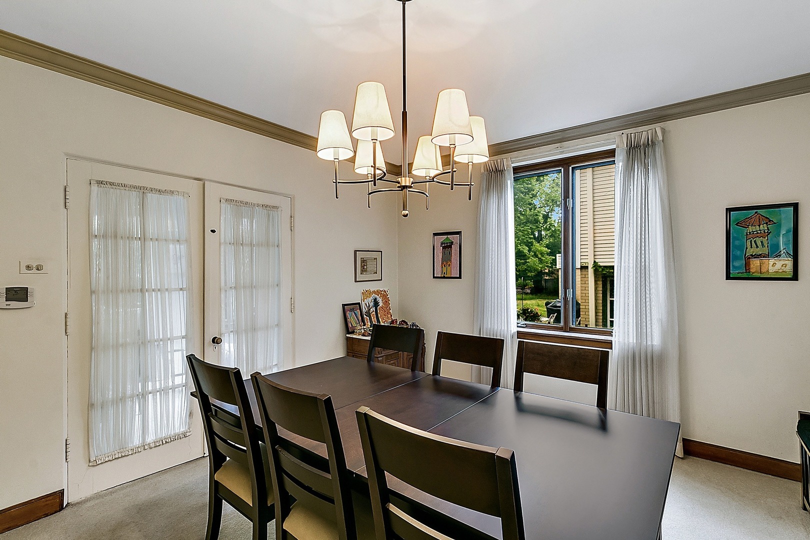 424 Uvedale Road Riverside, IL 60546 - Photo 7 of 46 a view of a dining room with furniture window and wooden floor