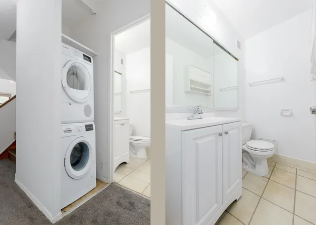 a bedroom with a bed and a lamp