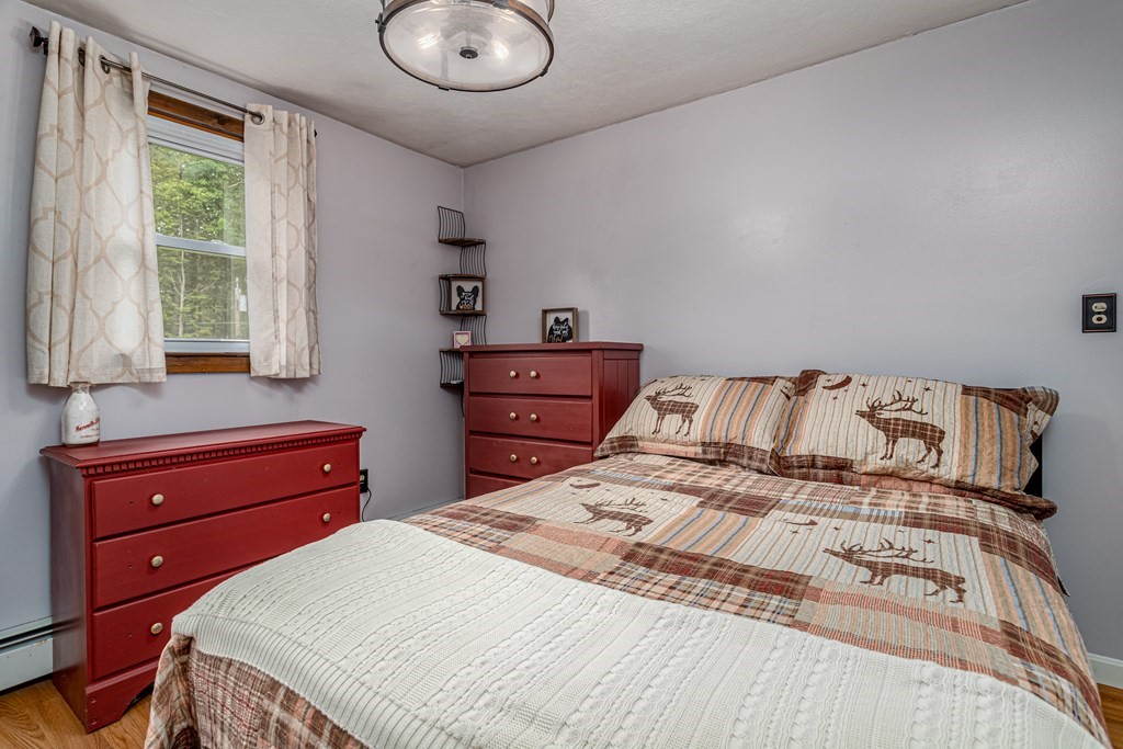 70 Valley Road Lunenburg, MA 01462 - Photo 11 of 42 a bedroom with a bed and a dresser