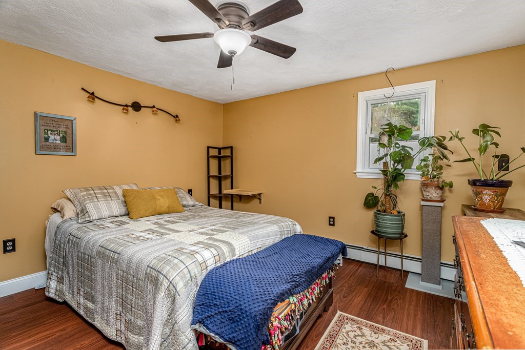 70 Valley Road Lunenburg, MA 01462 - Photo 13 of 42 a bedroom with a bed and wooden floor