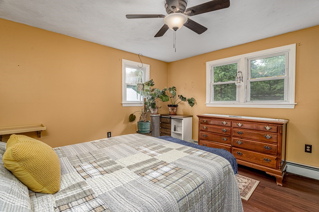 70 Valley Road Lunenburg, MA 01462 - Photo 14 of 42 a bedroom with a bed and wooden floor