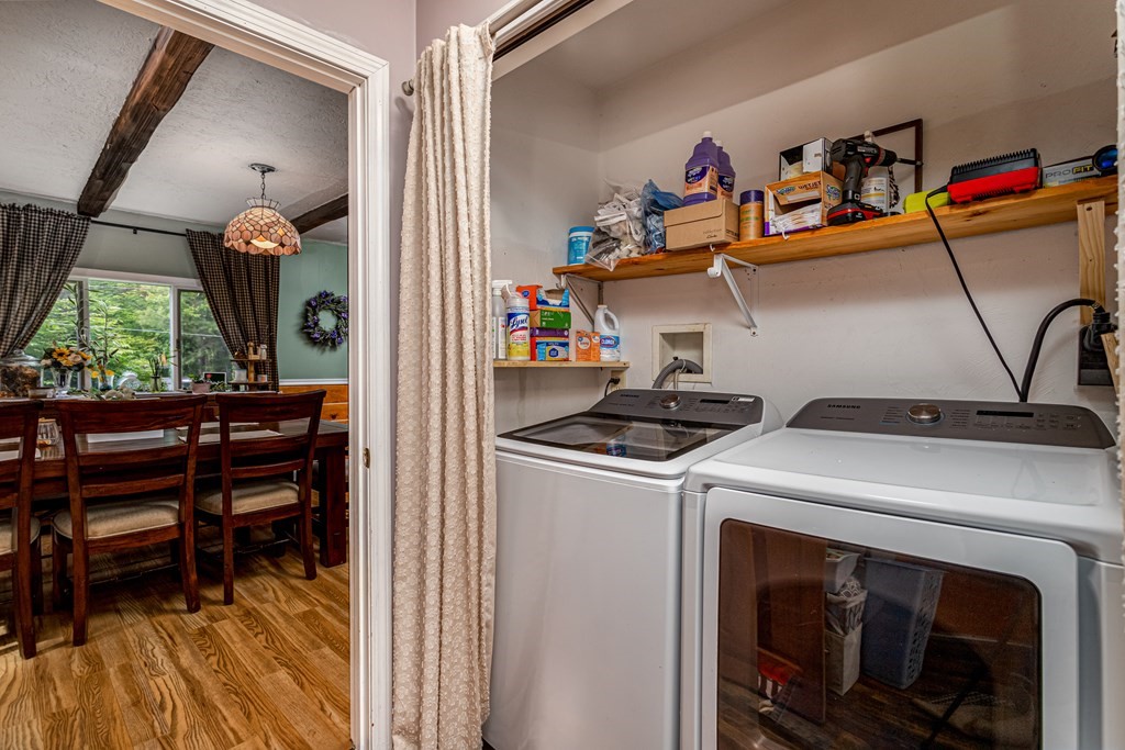 70 Valley Road Lunenburg, MA 01462 - Photo 18 of 42 a utility room with dryer washer and a view of living room