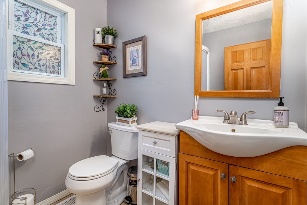 70 Valley Road Lunenburg, MA 01462 - Photo 21 of 42 a bathroom with a sink a toilet and mirror