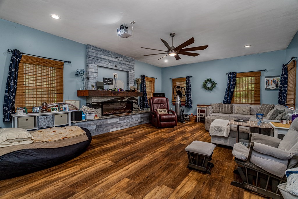 70 Valley Road Lunenburg, MA 01462 - Photo 24 of 42 a living room with furniture ceiling fan and a wooden floor