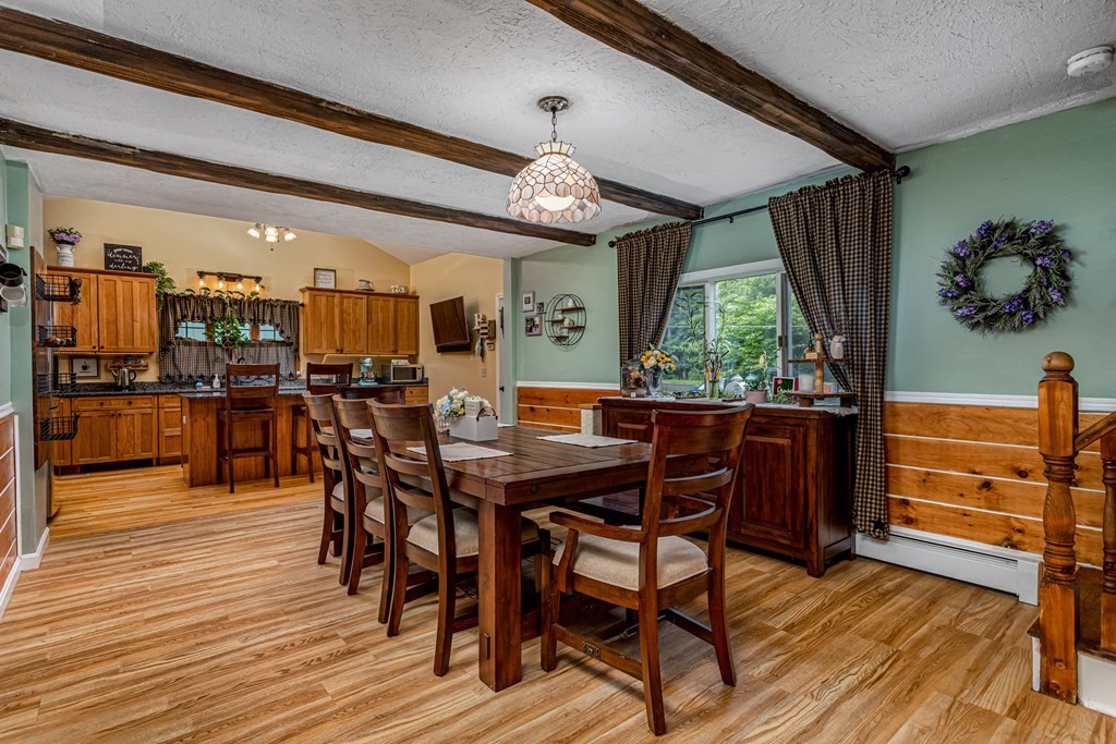 70 Valley Road Lunenburg, MA 01462 - Photo 27 of 42 a view of a dining room with furniture window and wooden floor