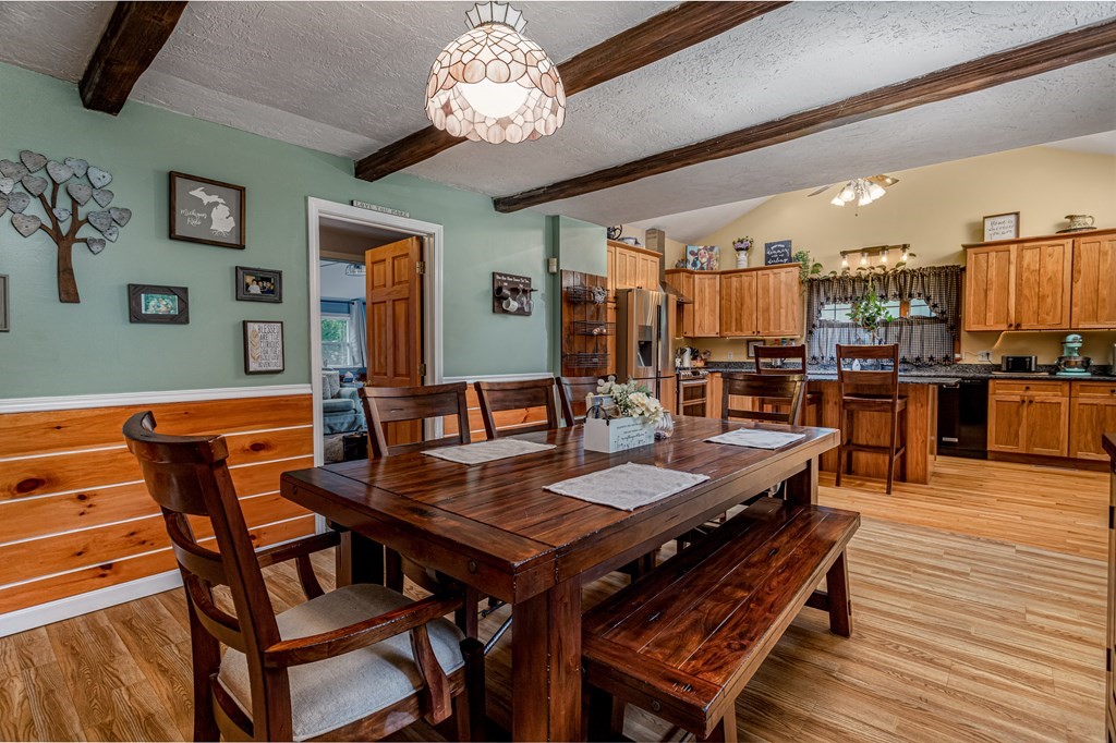 70 Valley Road Lunenburg, MA 01462 - Photo 28 of 42 a view of a dining room with furniture wooden floor and chandelier