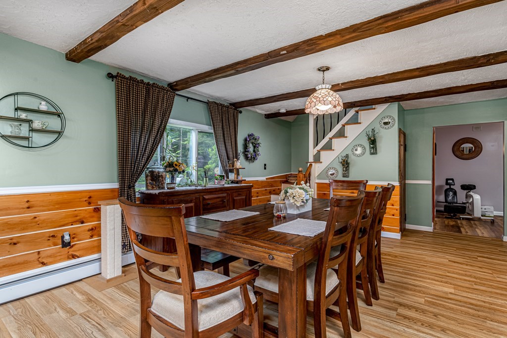 70 Valley Road Lunenburg, MA 01462 - Photo 30 of 42 a dining room with furniture and wooden floor