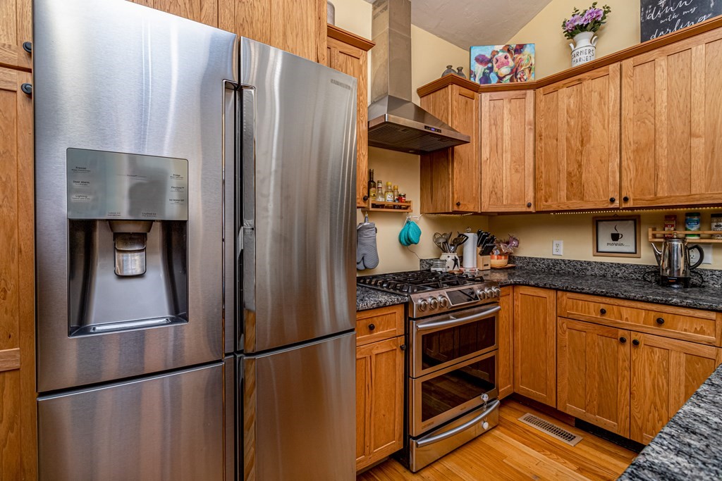 70 Valley Road Lunenburg, MA 01462 - Photo 33 of 42 a kitchen with stainless steel appliances granite countertop a refrigerator and a stove