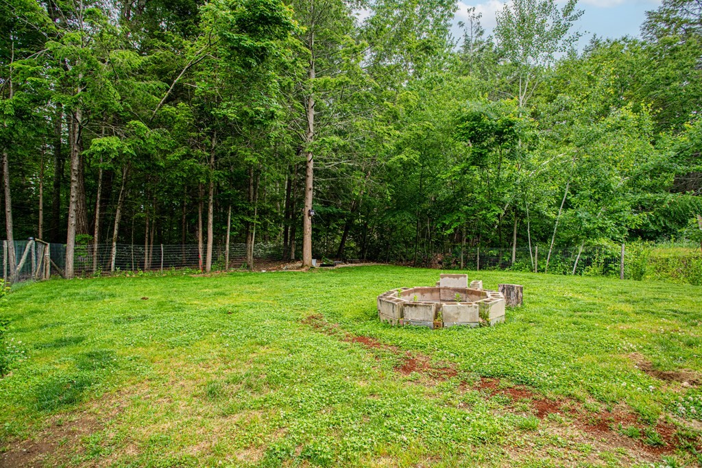 70 Valley Road Lunenburg, MA 01462 - Photo 38 of 42 a view of a backyard with table and chairs