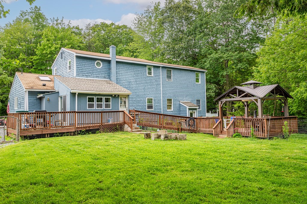 70 Valley Road Lunenburg, MA 01462 - Photo 40 of 42 a view of a house with a yard and sitting area