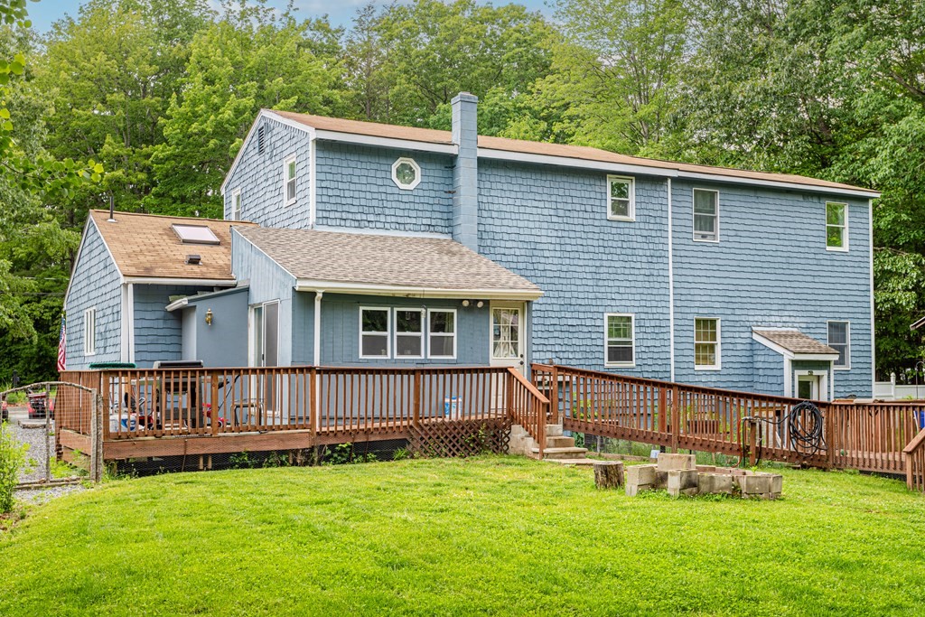 70 Valley Road Lunenburg, MA 01462 - Photo 41 of 42 a view of a house with a yard and a deck