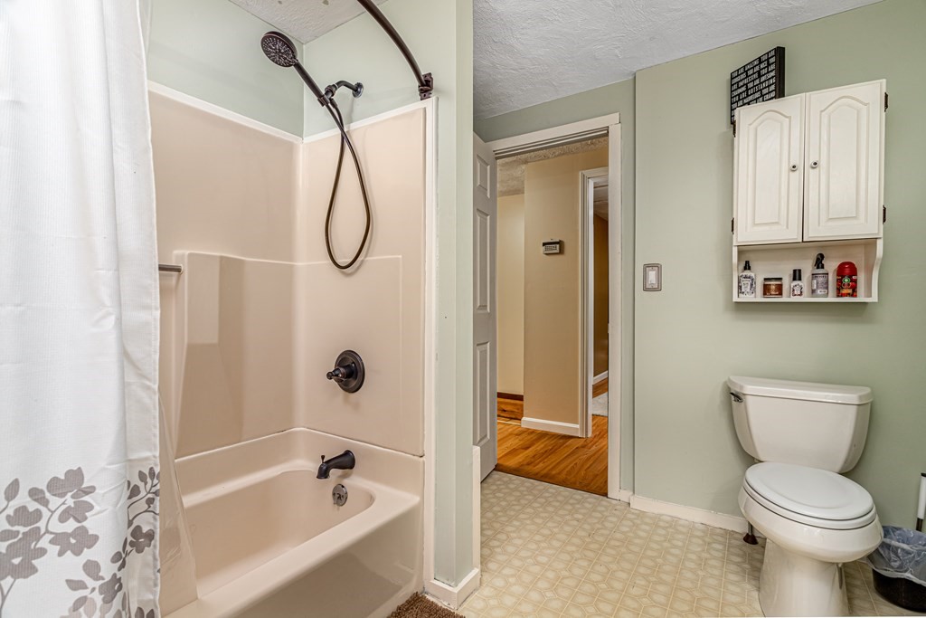 70 Valley Road Lunenburg, MA 01462 - Photo 8 of 42 a bathroom with a toilet and a shower