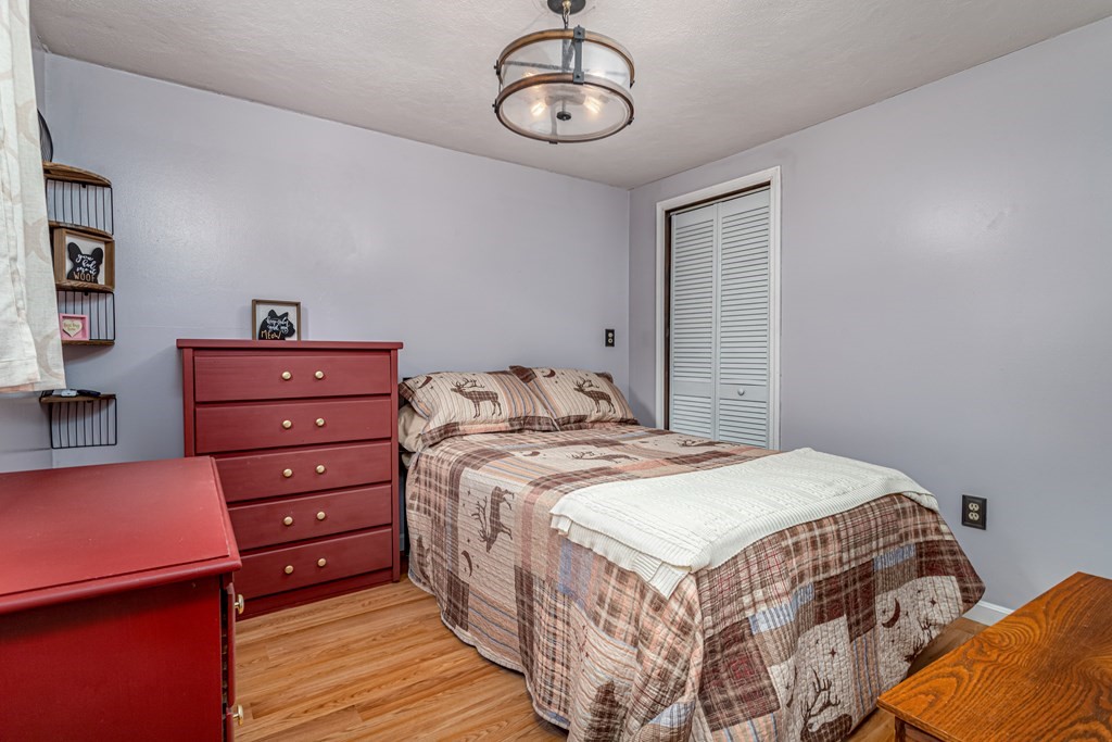 70 Valley Road Lunenburg, MA 01462 - Photo 9 of 42 a bedroom with a bed and cabinets