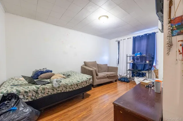 a bedroom with bed and window