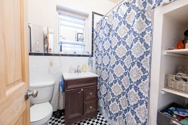 a bathroom with a toilet and a sink