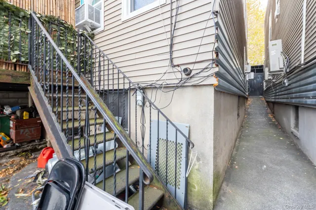 a view of entryway with wooden floor and stairs