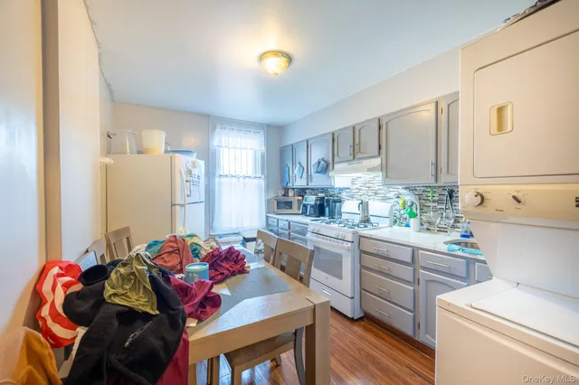 a kitchen with a sink cabinets and window