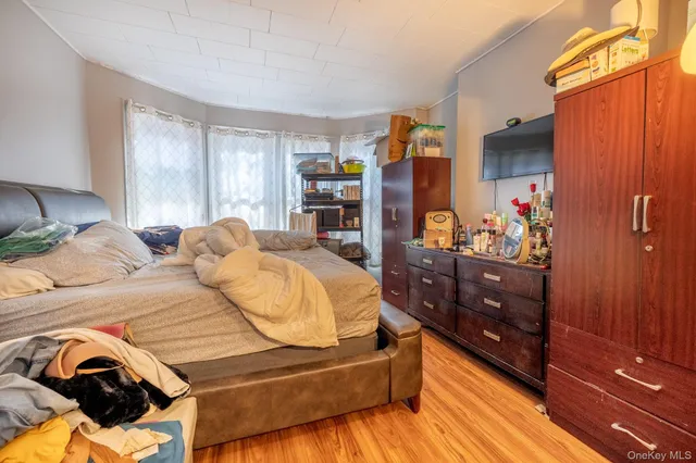 a bedroom with a bed and a dresser