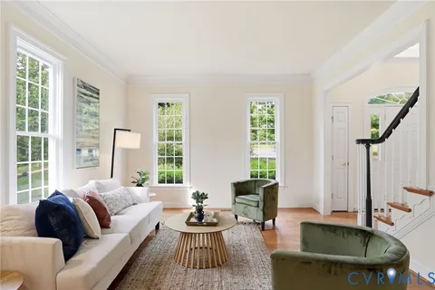 a kitchen with stainless steel appliances granite countertop a stove top oven a sink dishwasher a dining table and chairs with wooden floor
