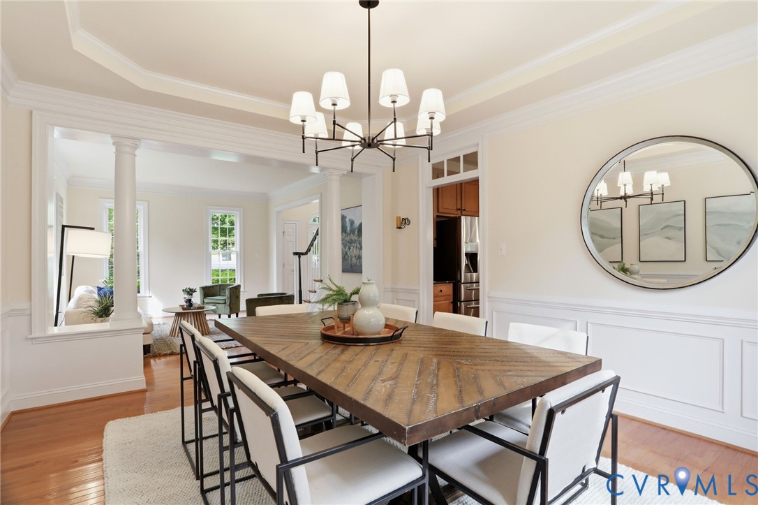 14331 Roderick Court Midlothian, VA 23113 - Photo 13 of 71 a view of a dining room with furniture a chandelier and wooden floor