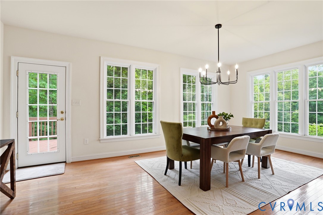 14331 Roderick Court Midlothian, VA 23113 - Photo 19 of 71 a view of a dining room with furniture window and wooden floor