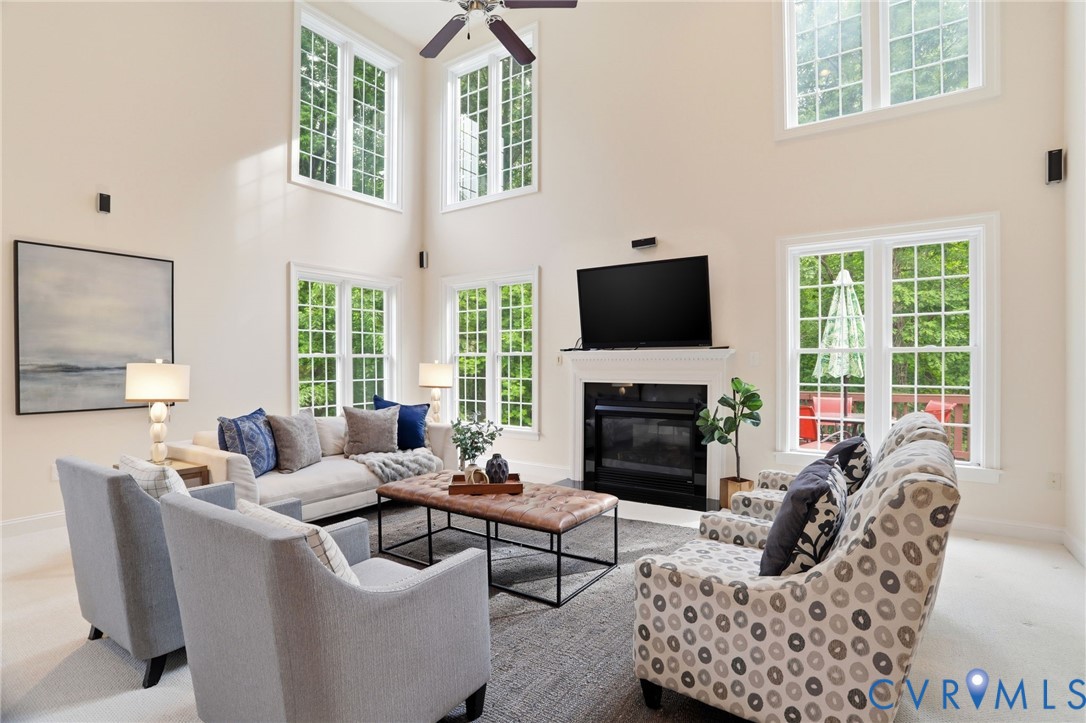 14331 Roderick Court Midlothian, VA 23113 - Photo 21 of 71 a living room with furniture a fireplace and a flat screen tv