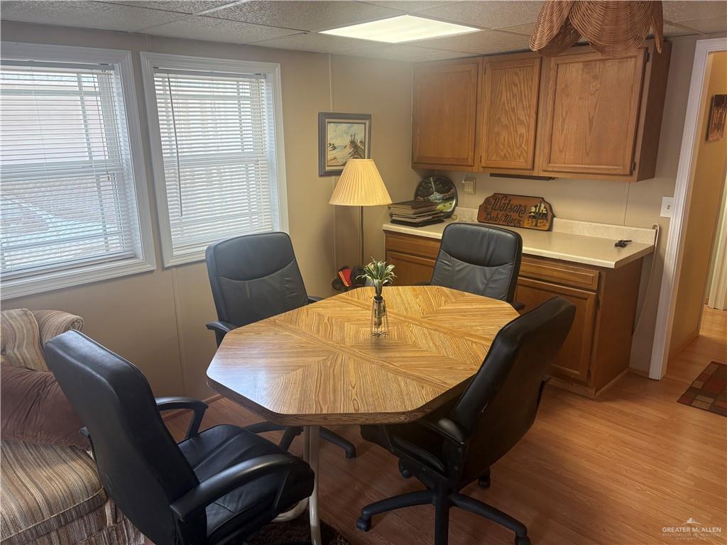 197 Laurel Road Pharr, TX 78577 - Photo 12 of 38 a view of a dining room with furniture and wooden floor