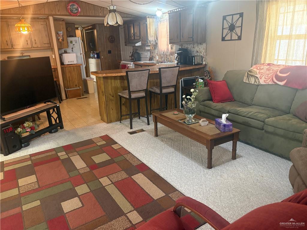 197 Laurel Road Pharr, TX 78577 - Photo 14 of 38 a living room with patio furniture and a flat screen tv