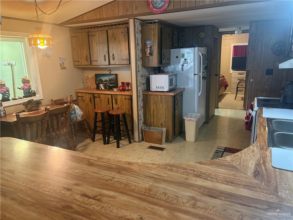 197 Laurel Road Pharr, TX 78577 - Photo 17 of 38 a kitchen with stainless steel appliances granite countertop a refrigerator and a sink