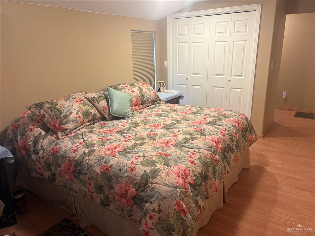 197 Laurel Road Pharr, TX 78577 - Photo 21 of 38 a bedroom with a bed and walk in closet