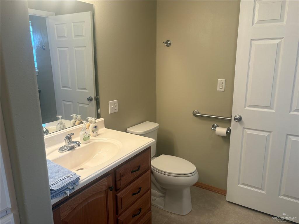 197 Laurel Road Pharr, TX 78577 - Photo 26 of 38 a bathroom with a sink a toilet and shower
