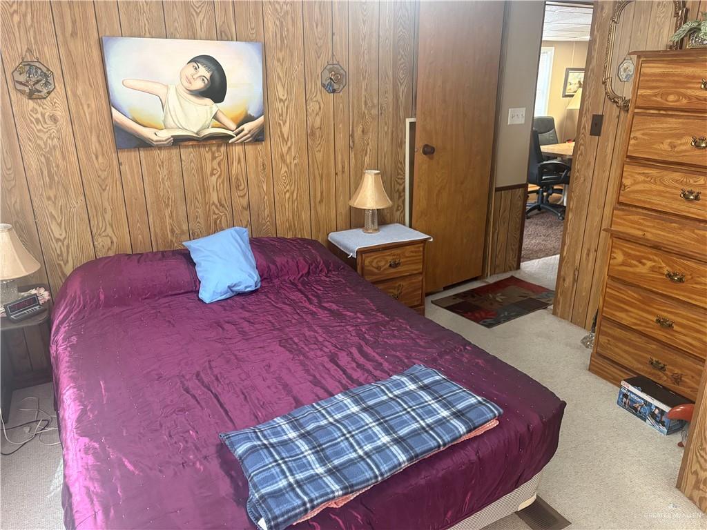 197 Laurel Road Pharr, TX 78577 - Photo 33 of 38 a bedroom with a bed and a mirror