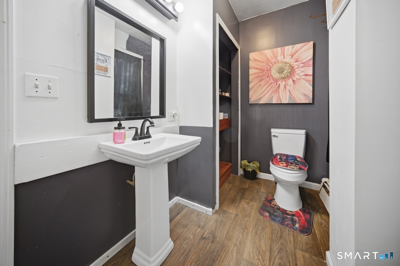 12 Webster Street Vernon, CT 06066 - Photo 16 of 33 a bathroom with a sink toilet and a mirror