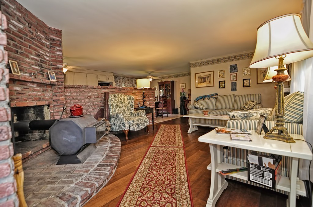 13 Sunnyvale Street Beverly, MA 01915 - Photo 15 of 25 a living room with furniture and a fireplace