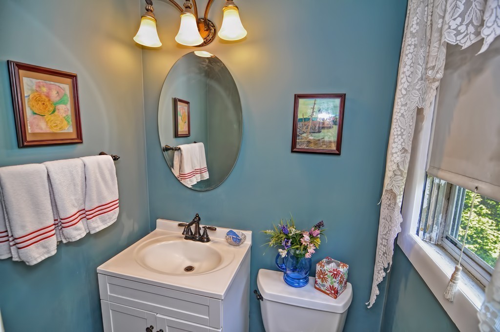 13 Sunnyvale Street Beverly, MA 01915 - Photo 20 of 25 a bathroom with a sink mirror and vanity
