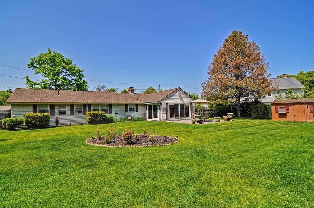 13 Sunnyvale Street Beverly, MA 01915 - Photo 3 of 25 a front view of a house with a yard