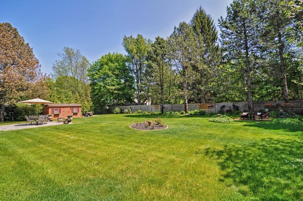 13 Sunnyvale Street Beverly, MA 01915 - Photo 4 of 25 a view of a house with a yard and sitting area