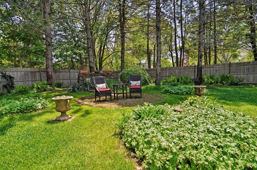 13 Sunnyvale Street Beverly, MA 01915 - Photo 7 of 25 a view of a chair and table in the garden