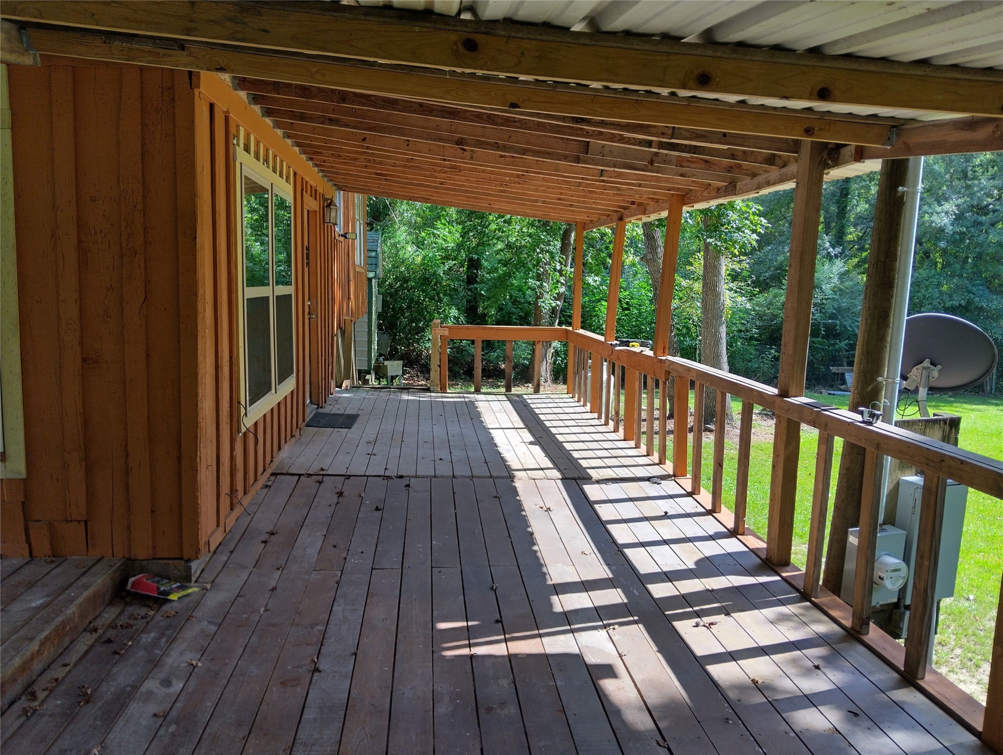 260 County Road 360 Splendora, TX 77372 - Photo 11 of 15 a view of balcony with wooden floor