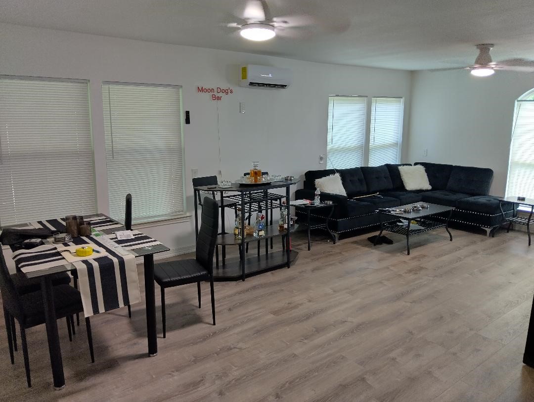 260 County Road 360 Splendora, TX 77372 - Photo 4 of 15 a room with lots of chairs and a projector screen